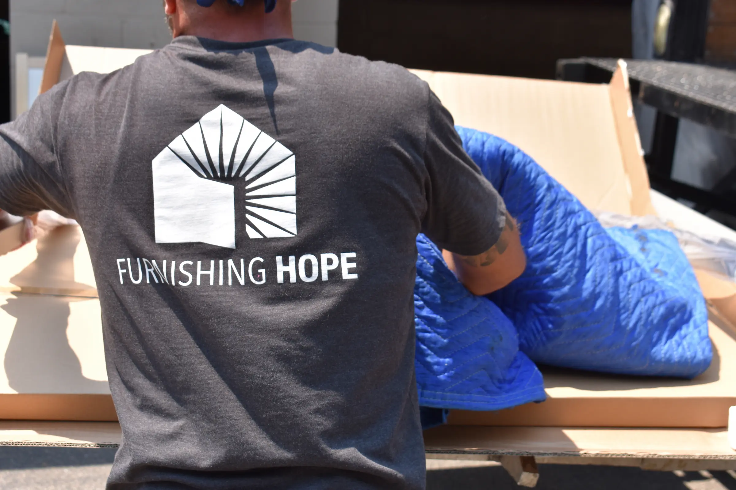 Furnishing Hope volunteers assembling care packages